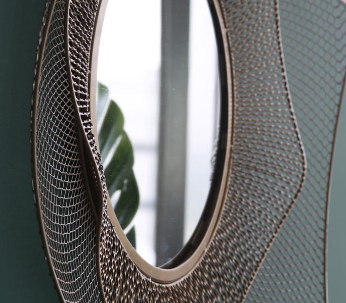 Hand cut iron mirror