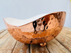 Hand hammered copper bowl with white enamel inside