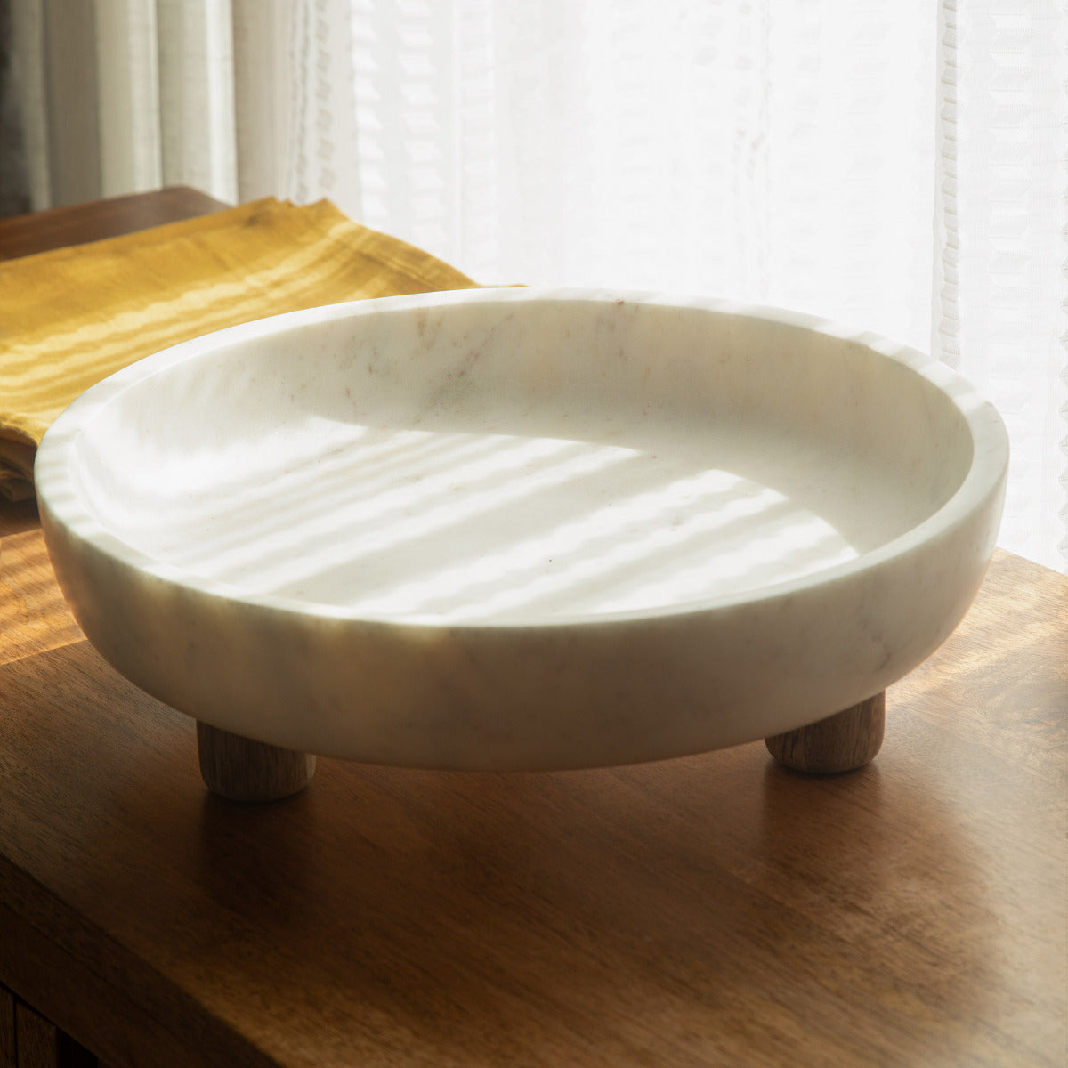 Marble bowl with wooden legs