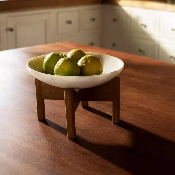 White marble bowl with wooden stand