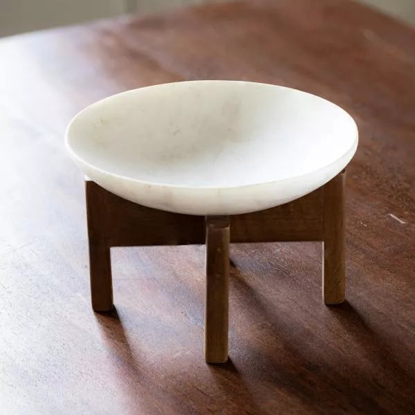 White marble bowl with wooden stand